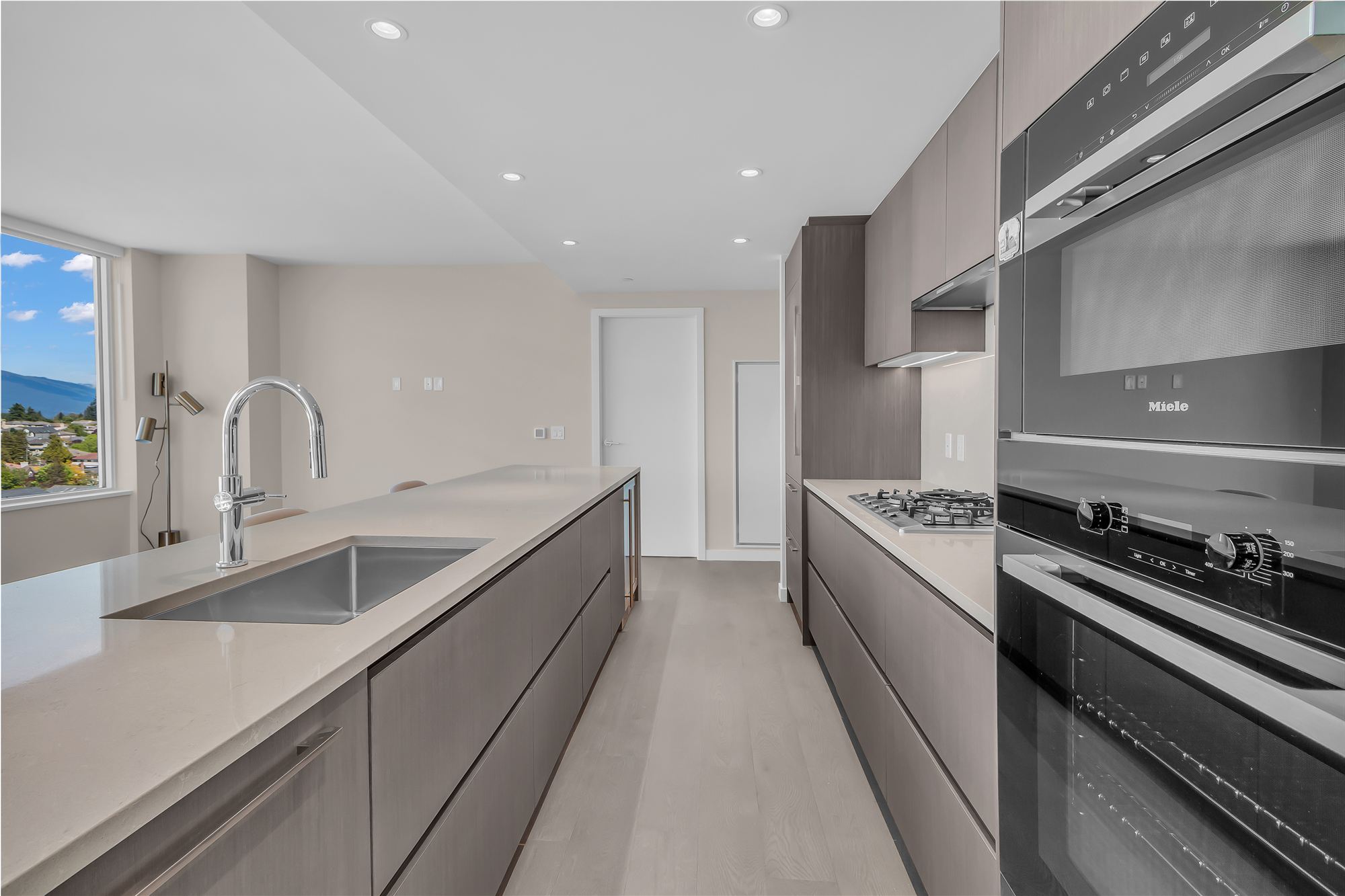Chef kitchen with Miele appliances and mountain view
